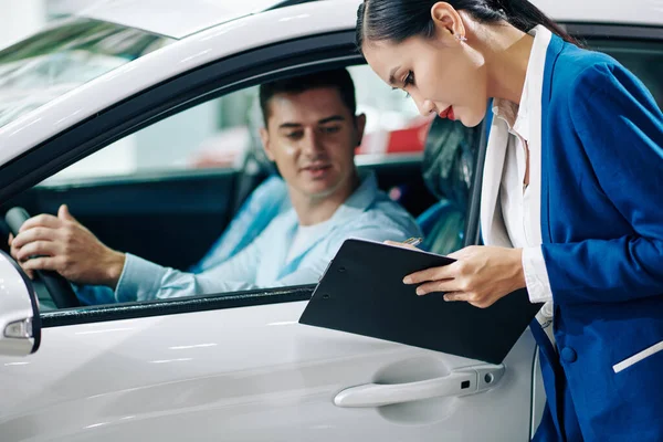 Car Dealership Manager Filling Customer Details Document Test Drive — Stock Photo, Image