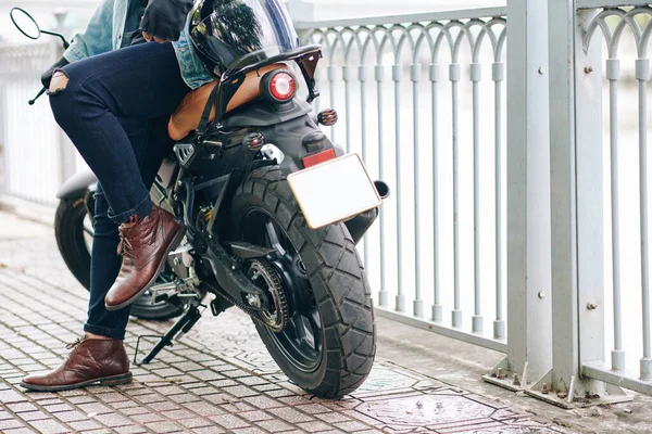 Cropped Image Confident Man Leather Boots Ripped Jeans Leaning Motorcycle — Stock Photo, Image