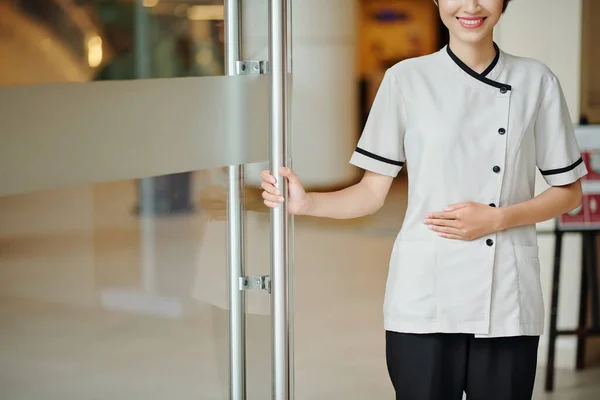 Cropped Image Smiling Young Hotel Manager Uniform Opening Glass Entrance — Stock Photo, Image