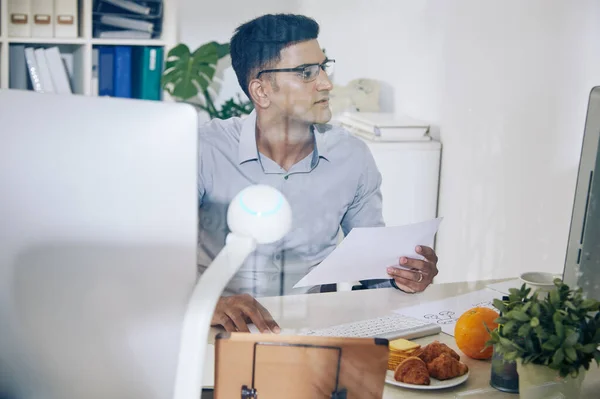 Pensive Young Indian Programmer Document Hand Reading Information Computer Screen — Stock Photo, Image