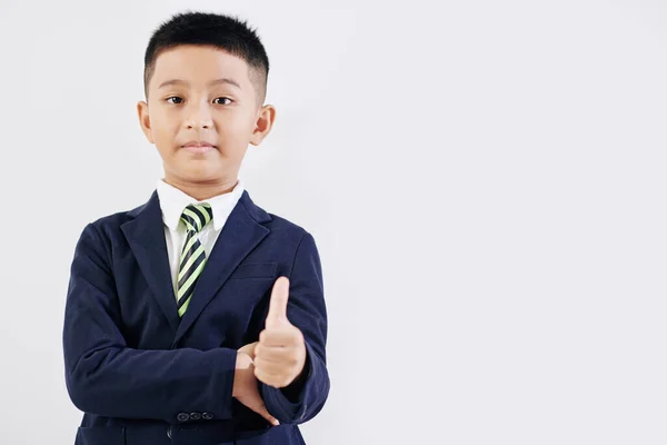 Gelukkige Schooljongen Schooluniform Tonen Duimen Geïsoleerd Wit — Stockfoto