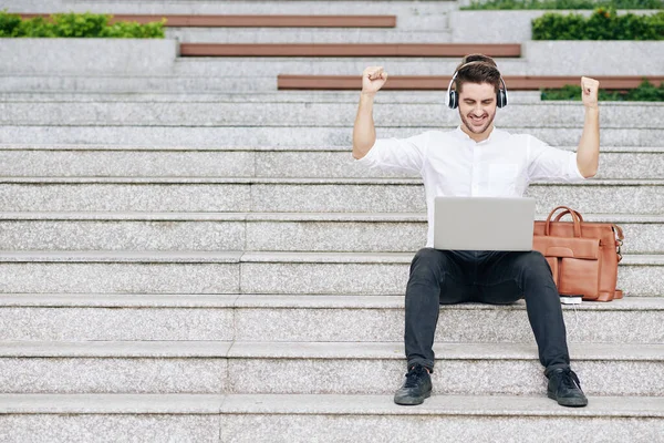 Excited Young Businessman Raising Arms Celebrate Finishing Big Project — Stock Photo, Image