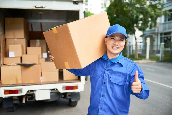 Portrait Cheerful Delivery Man Blue Uniform Carrying Cardboard Box Showing — Stock Photo, Image