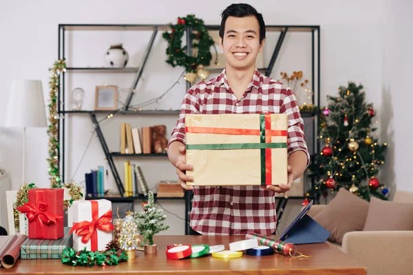 Cheerful Vietnamese Man Holding Big Wrapped Christmas Present Friend Family — 图库照片