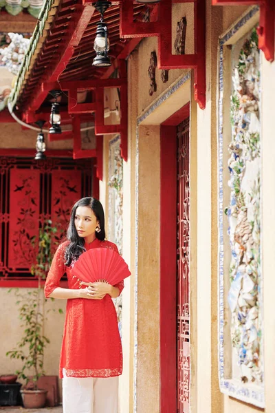 Beautiful Pensive Young Asian Woman Red Paper Fan Standing Temple — Stock Photo, Image