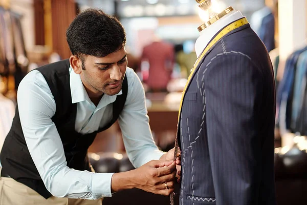 Talented Young Indian Tailor Working Bespoke Suit Mannequin Measuring Parts — Stock Photo, Image