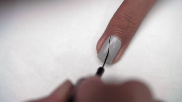 Close Female Hand Applying Black Stripes Polished Female Fingernail Using — Stock Video