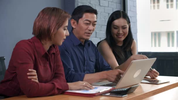 Lockdown Male Female Asian Colleagues Sitting Together Desktop Looking Laptop — Stock Video