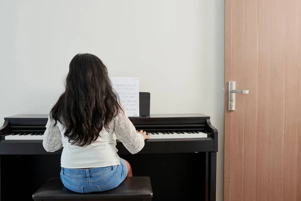 Little Girl Learning Symphony Playing Piano Home View Back — Stock Photo, Image