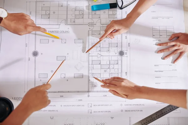 Hands Architects Designers Pointing Blueprint Table Discussing Future Interior Design — Stock Photo, Image