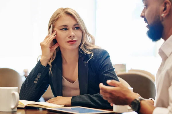 Pensive Pretty Young Businesswoman Listening Ideas Her Colleague Having Meeting — Stock Fotó