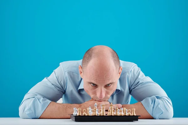 Pensive Middle Aged Man Learning Table Looking Chessboard Front Him — Stock Photo, Image