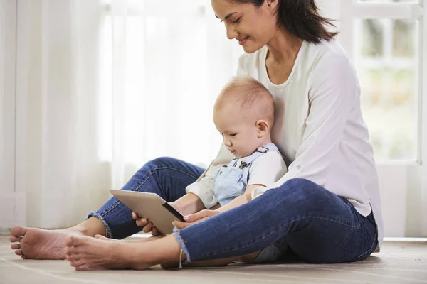 Smiling Mom Baby Boy Sitting Floor Playing Game Tablet Computer — Stock Photo, Image