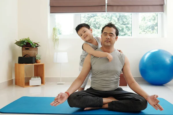 Smiling Little Boy Standing Next His Father Meditating Lotus Position — Foto Stock