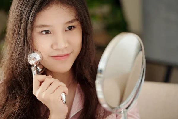 Beautiful Young Woman Looking Mirror Massaging Face Roller Applying Serum — Stock Photo, Image