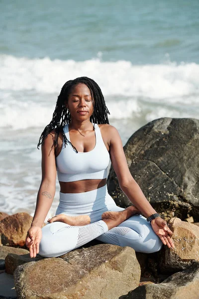 Calm Relaxed Young Woman Meditating Rocky Beach Enjoying Sound Waves — Stock Photo, Image