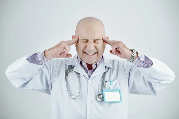 Annoyed Mature Caucasian Doctor Bald Head Closing Eyes Touching Temples — Stock Photo, Image