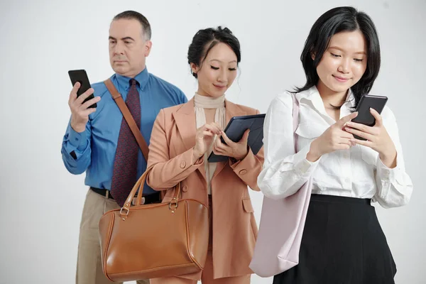 Business People Checking Social Media Reading News Smartphones Tablet Computer — Stock Photo, Image