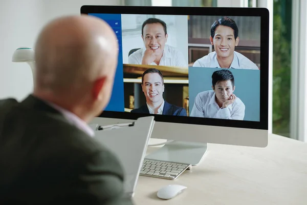 Online conference on computer with colleagues — Stock Photo, Image