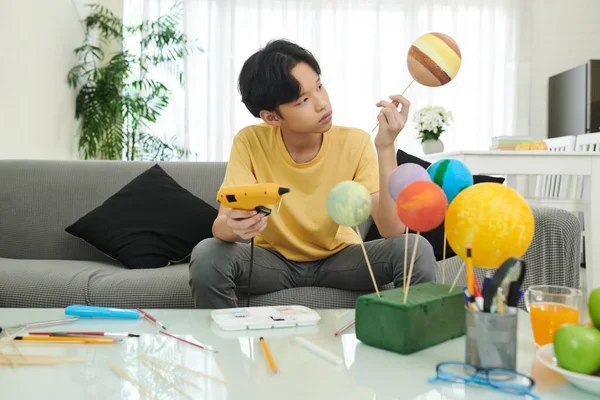 Boy Glueing Styrofoam Planets — Stock fotografie