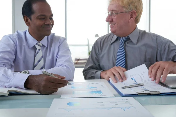 Happy Middle-aged Businessman Showing Reports — Stock Photo, Image