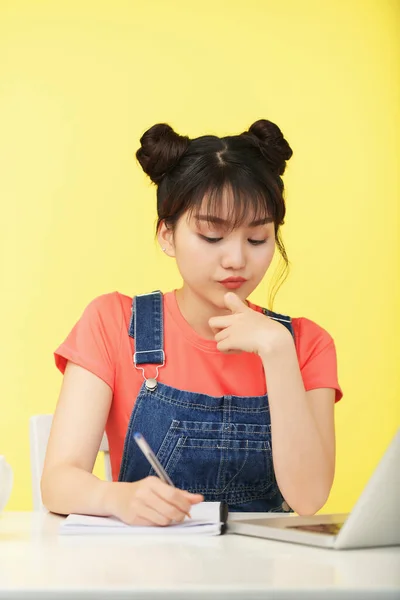 Pretty Young Woman Writing in Copybook — Stock fotografie