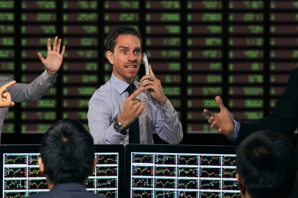 Trader gesturing at stock exchange — Stock Photo, Image