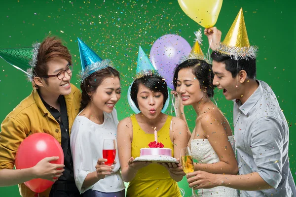 Vietnamese young woman blowing candle — Stock Photo, Image