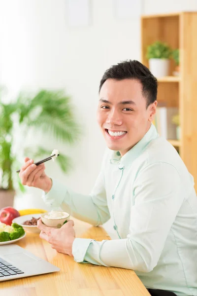 Vietnamese manager eating — Stock Photo, Image