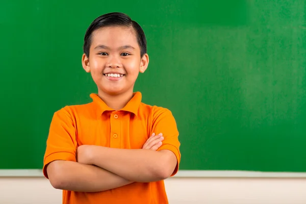 Cheerful Vietnamese schoolboy Stock Image