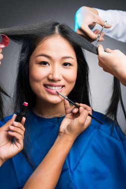 Vietnamese woman in beauty salon clipart