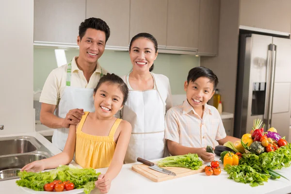 Asian family in kitchen