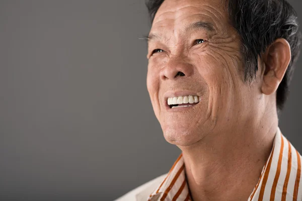 Laughing senior Vietnamese man — Stock Photo, Image