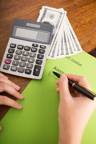 Bookkeeper counting monthly income — Stock Photo, Image