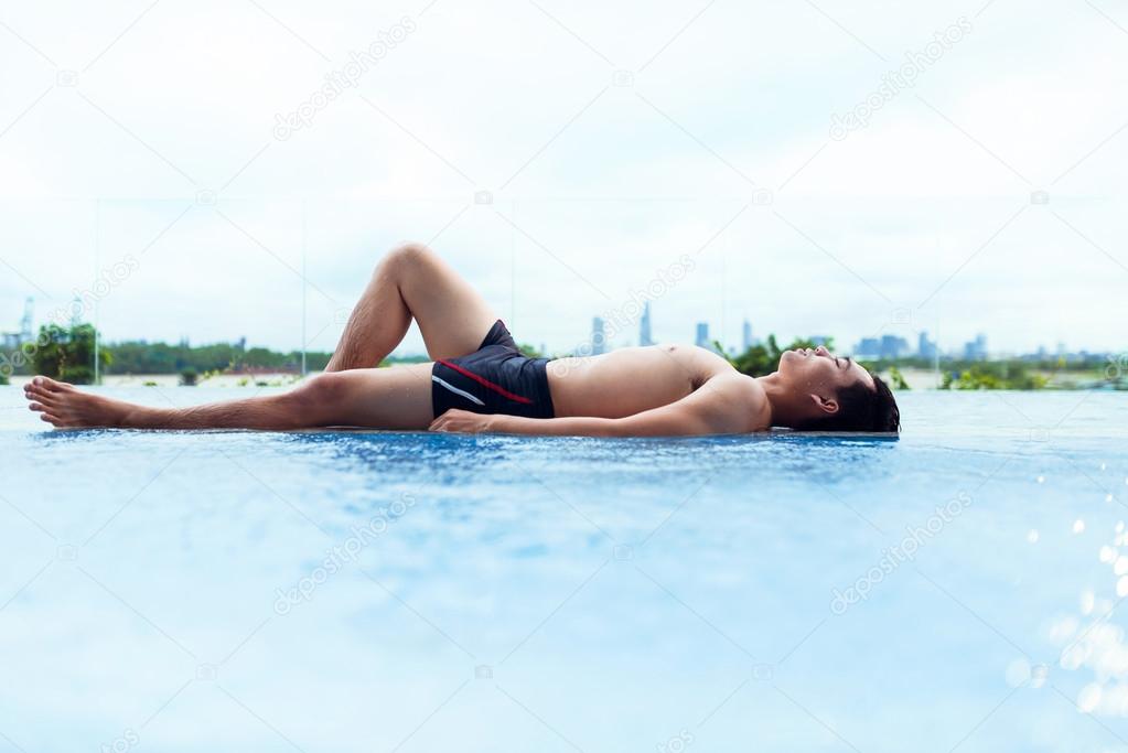 Man relaxing in the pool