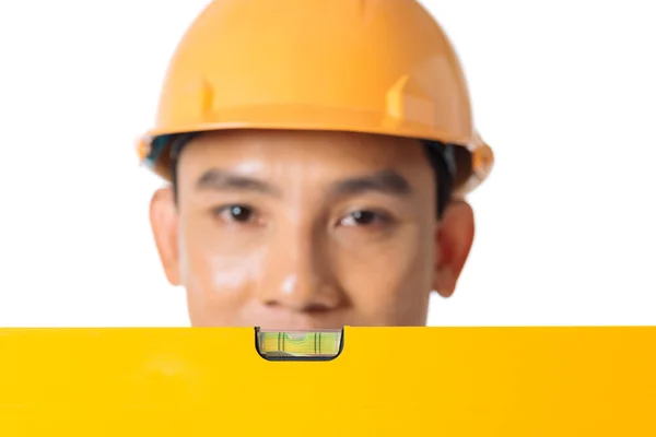 Measuring level in front of head — Stock Photo, Image