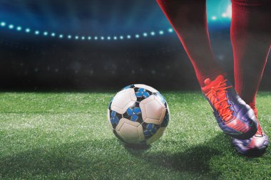 Soccer ball and feet of soccer player clipart