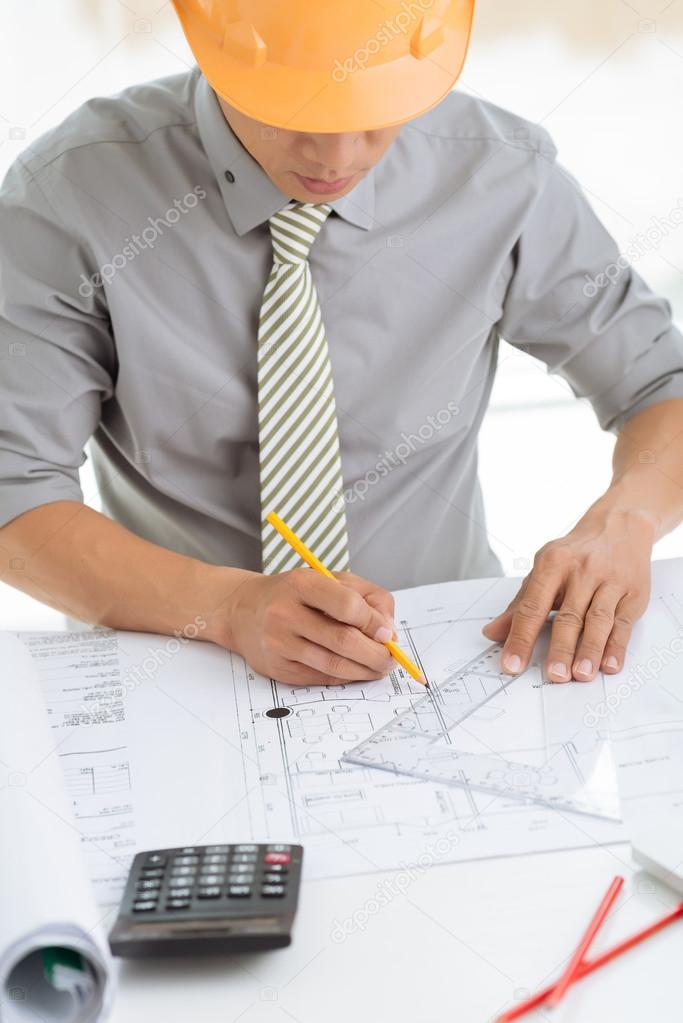 Architect with blueprint