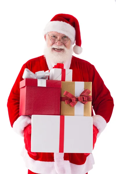Santa segurando caixas de presente — Fotografia de Stock