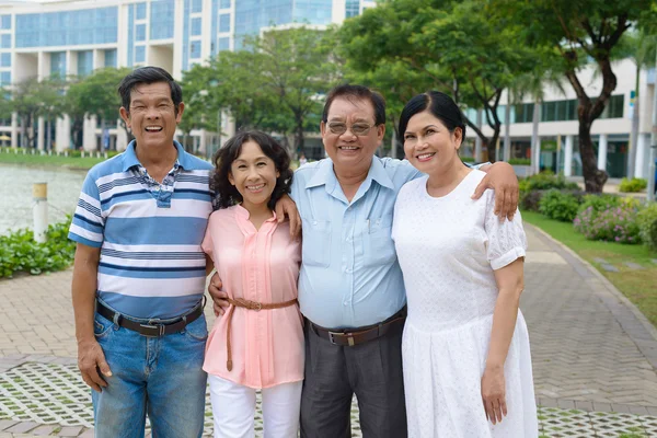 Hugging senior friends — Stock Photo, Image