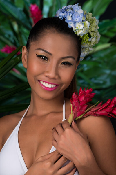 Filipina with red ginger flower