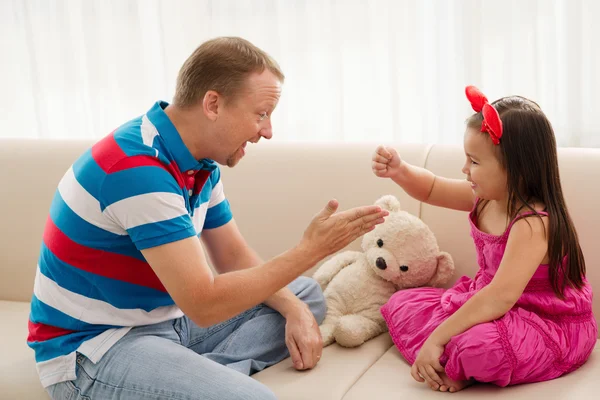 Father and daughter playing together — Stock Photo, Image