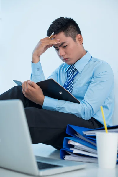 Manager sitting on the floor and reading