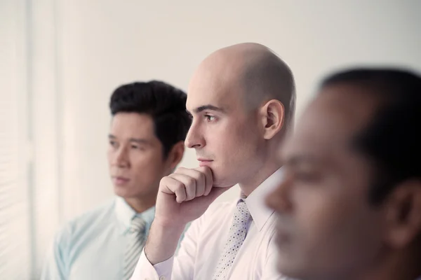 Pensive business people — Stock Photo, Image