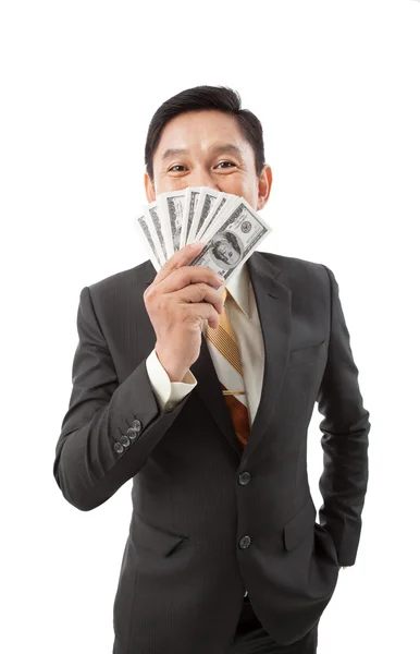 Businessman smelling money — Stock Photo, Image