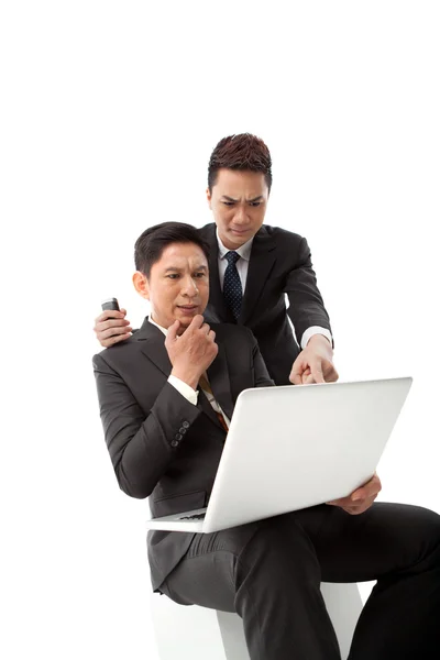 Confused managers looking at the laptop screen — Stock Photo, Image