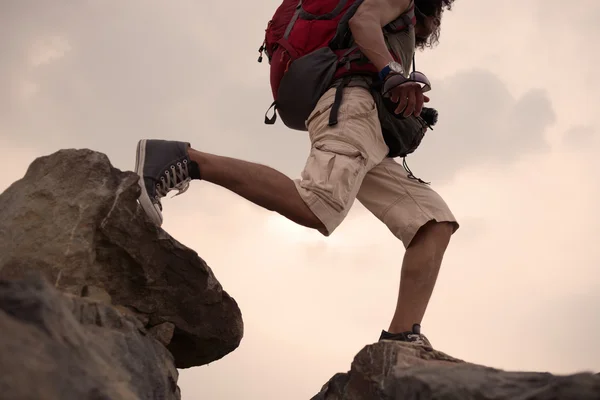 Hiker Crossing the rocky terrain — Stock Photo, Image