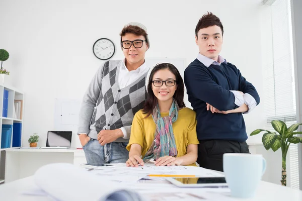 Team of smiling Vietnamese architects — Stock Photo, Image