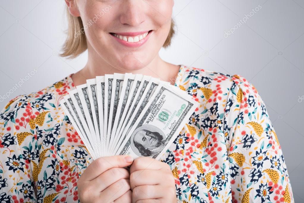 Woman holding money in her hands