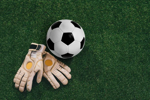 Soccer ball and goalkeeper gloves — Stock Photo, Image